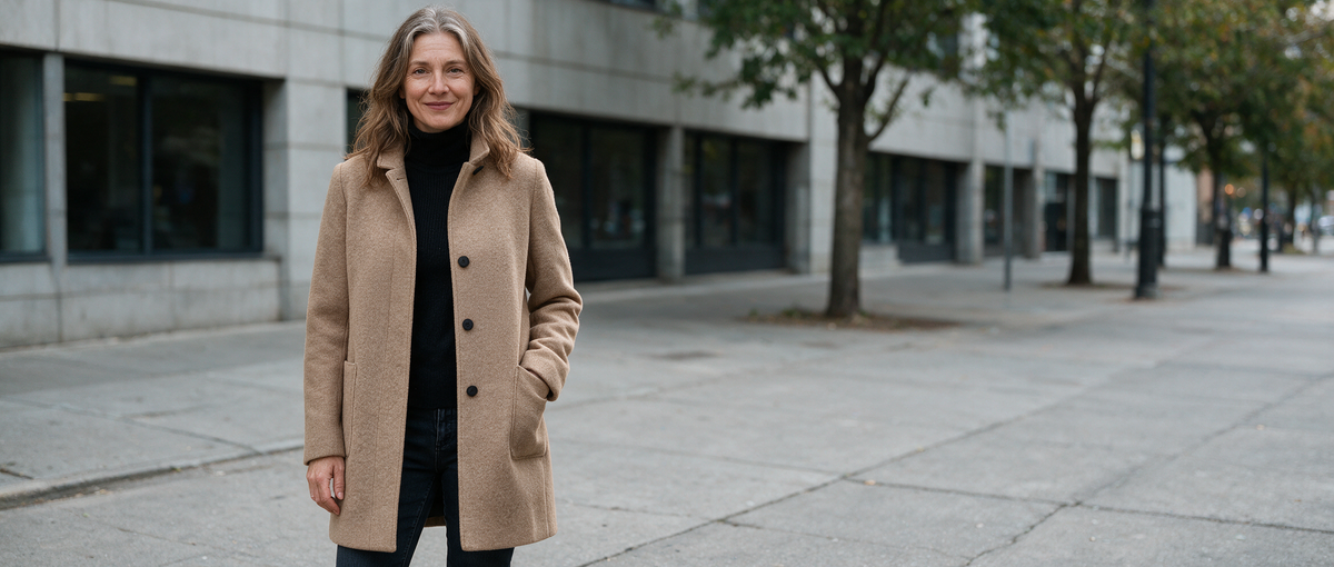 Style-Street hero - woman in camel wool coat on city sidewalk